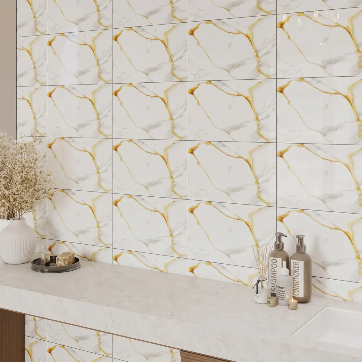 Gold-veined white marble-look wall tiles above a stone vanity top, with a vase of dried flowers and bathroom toiletries